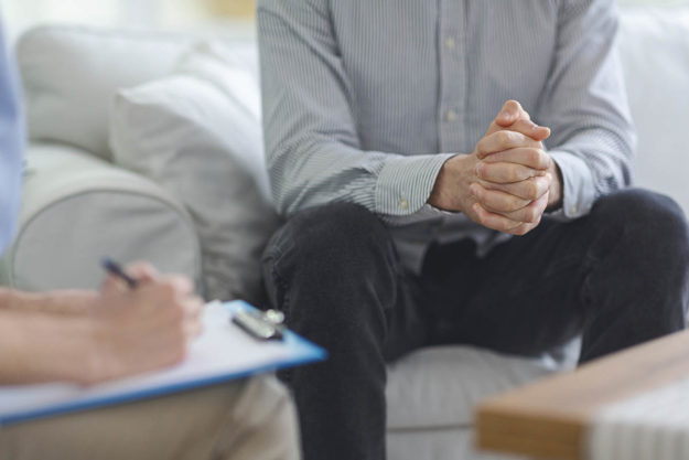 a man is happy to find a dual diagnosis treatment centers near me