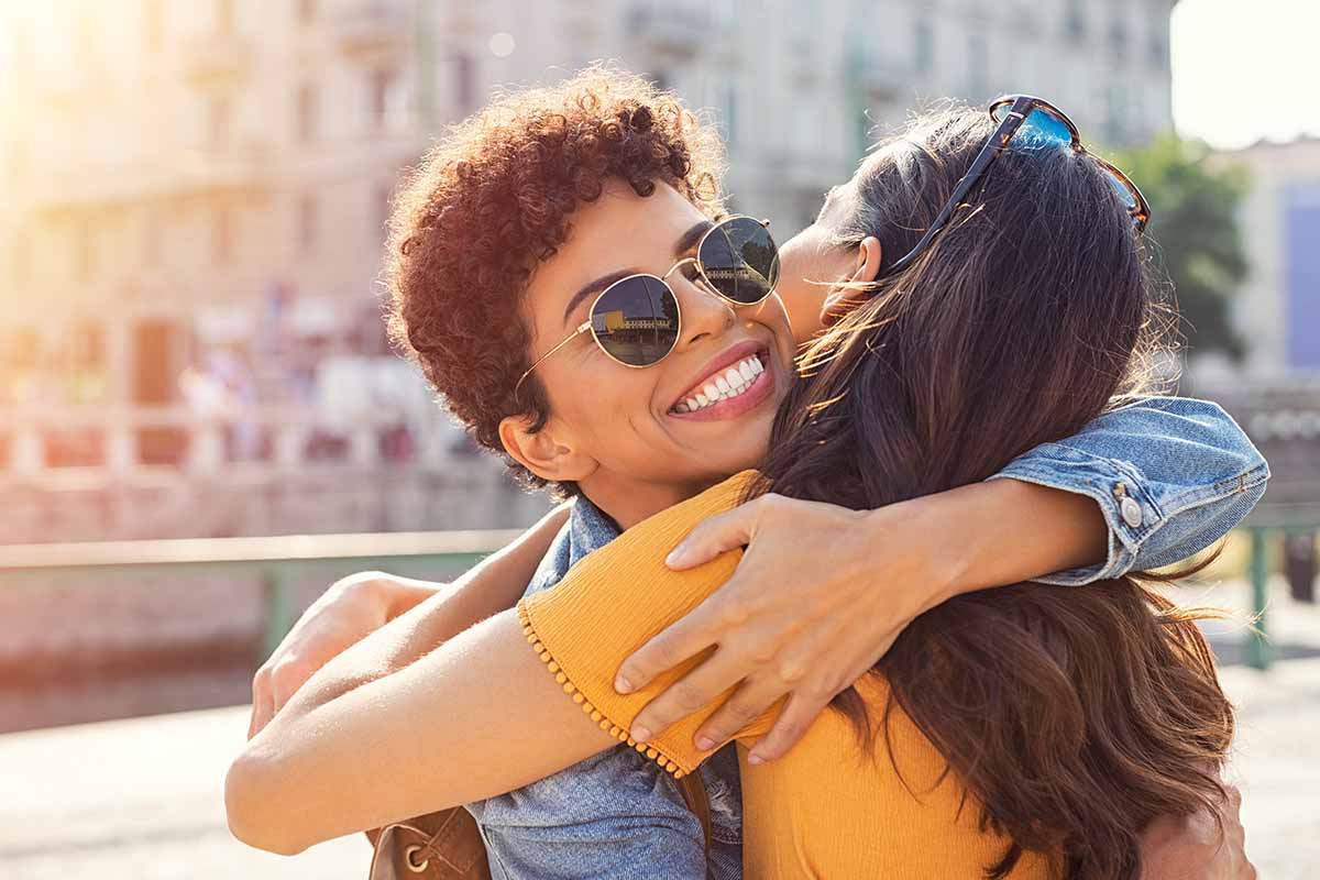 two friends hug on suicide prevention day