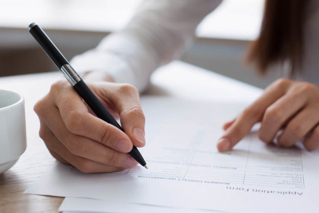 a person works on an admissions for rehab form