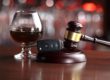 a glass of alcohol and a gavel showing the consequences for first-time DUI offenders