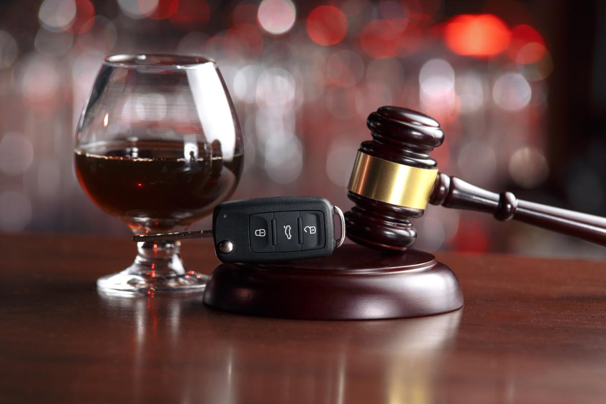 a glass of alcohol and a gavel showing the consequences for first-time DUI offenders